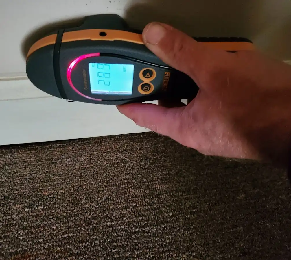 Moisture detection at baseboard during Burst Pipe Cleanup in DeLand